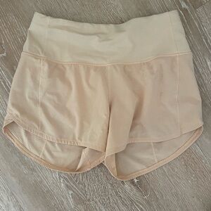 LULULEMON SPEED UP HR SHORTS 2.5”, light orange, back zipper, high waisted; 4